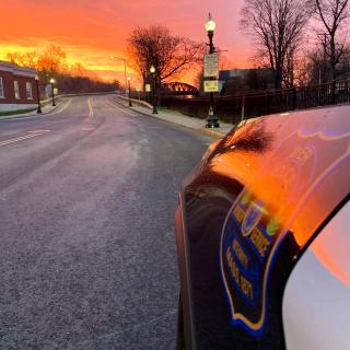 Ayer Police Department Cruiser at East Main St Bridge with Fire Red Sky