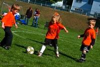 Image of children playing soccer